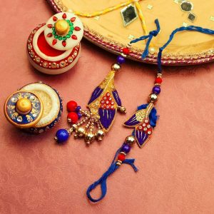 Alluring Blue and Red Zari Beads Bhaiya Bhabhi Rakhi